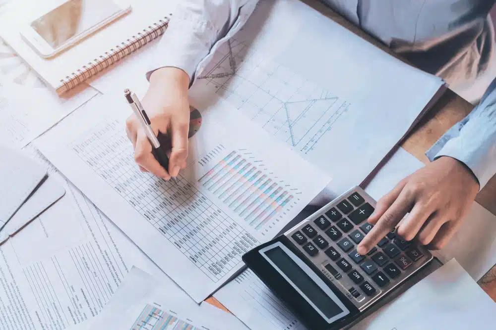 Businessman,Using,Calculator,For,Calculate,Budget.,Concept,Finance,And,Accounting remote accounting teams