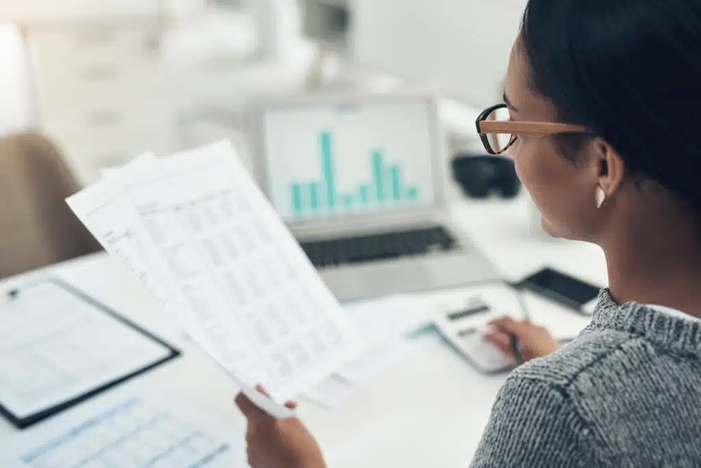 Closeup shot of an unrecognisable businesswoman calculating finances in an office accounting and finance jobs