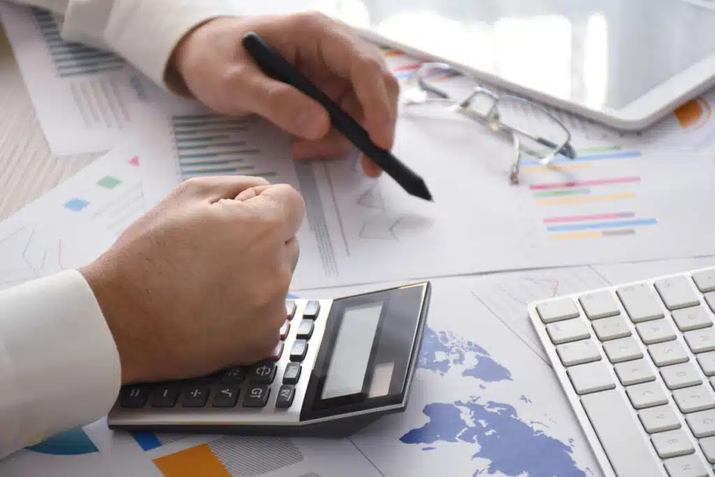 Business accounting concept, analyzing financial documents on the office desk with budget and loan paper accounting and finance jobs
